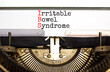 IBS irritable bowel syndrome symbol. Concept words IBS irritable bowel syndrome typed on old retro typewriter. White background. Medical and IBS irritable bowel syndrome concept. Copy space.