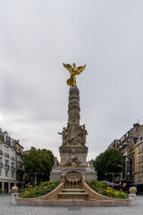 Sticker - view of the Sube Fountain statue with the golden angel in downtown Reims