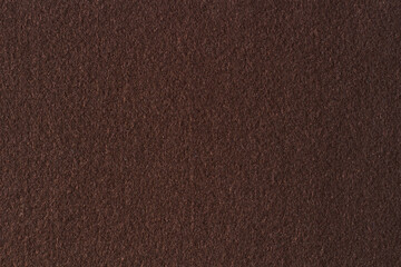 Brown color felt textile fabric material texture background. Abstract monochrome dark brown color background