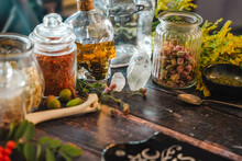 Occult Altar With Cristals, Herbs And Old Bones. Medicinal Plants In Vintage Bottles. Magical Potion In A Skull Bottle. Esoteric, Pagan, Wicca And Witchcraft With Magical Objects. Halloween Concept.