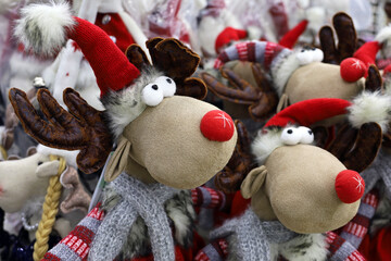 Wall Mural - Christmas toys in a store. Stuffed deer figures, New Year gifts for winter holidays