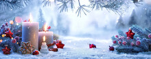 Christmas Decorations With Candles On A Snowy Background. Winter Forest Landscape