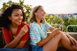 © Drobot Dean - Two young beautiful attractive happy smiling girls riding Ferris wheel