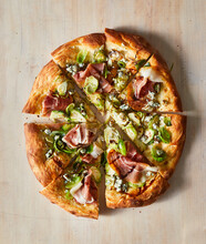 Brussels Sprouts Pizza On Wood Surface