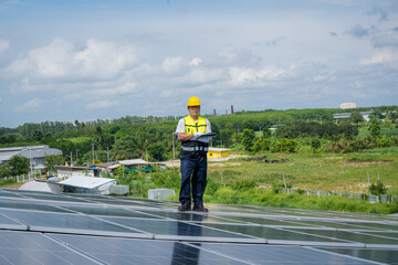 Wall Mural - Technician inspection and repair solar cell on the roof of factory,Solar PV Rooftop.