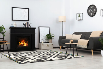 Canvas Print - Stylish living room interior with fireplace and comfortable sofa