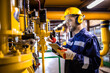 © littlewolf1989 - Heating plant technician standing by gas pipes and maintaining temperature inside power plant boiler room.