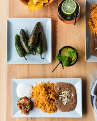 Sticker - Top view of jalapeno peppers with Enchilada and citrus drinks on a wooden surface