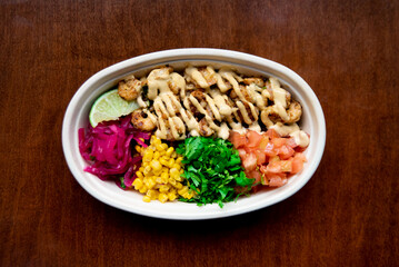 Sticker - Top view of a Poke dish on a wooden surface