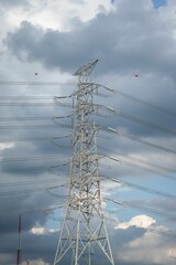 Sticker - Vertical shot of a pylon tower against a cloudy sky