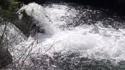 Wall Mural - water flowing into the water