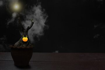 Wall Mural - An image of a potted plant monster placed on a wooden table with moon and clouds as a Halloween idea backdrop.