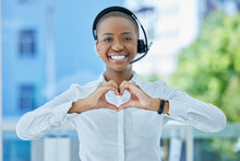 Hands, Heart And Call Center Consultant With Black Woman Happy, Smile And Excited About Customer Service Excellence. Black Woman, Hands And Love Sign By Advisor Passionate About Crm Business