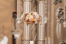 Tall Flower Centerpiece At A Wedding Reception. Flower Arrangement With Roses And Orchids. Flower Decor.