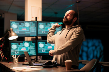 Aggressive male hacker throwing mouse in office, failing to hack computer interface and installing virus on server. Impostor acting angry and trying to steal software information, hacking failure.
