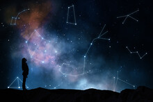 Horoscope And Fate Concept With Woman Silhouette On The Earth Looking At Starry Dark Sky With Constellations