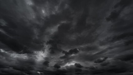 timelapse of dark dramatic sky with black stormy clouds before rain or snow as abstract background, 
