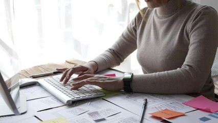 Website designer, Creative planning phone app development template layout framework wireframe design, User experience concept, Young asian woman UX designer working on smartphone application at office