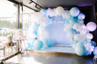 Photo zone for the boy's baptism is decorated with blue balls. Christening in restaurant