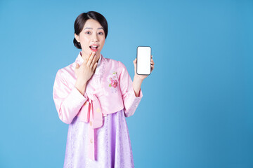 Wall Mural - Image of young Korean woman wearing hanbok on background