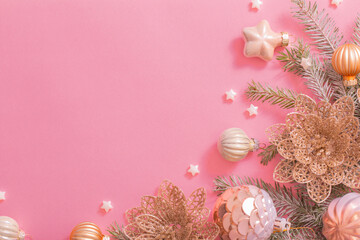 golden christmas decorations on pink background