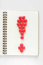 Chocolates Arranged On A Notebook To Represent Exclamation Mark