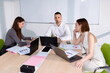 © makedonski2015 - Three colleagues are in the meeting room discussing business projects. Selective focus in the center of the photo