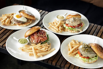 Wall Mural - selection of many different burgers on restaurant table