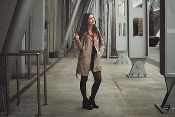 Smiling woman posing in urban background