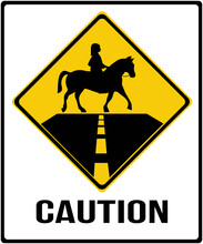 A Sign That Means : Caution With Horses Crossing The Road. Person Riding A Horse