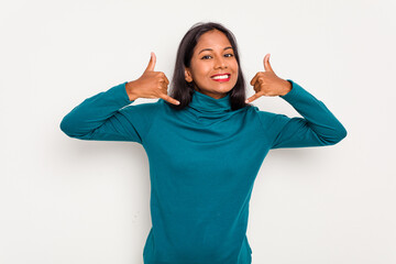 Wall Mural - Young Indian woman isolated on white background showing a mobile phone call gesture with fingers.