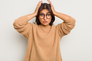 Wall Mural - Young Indian woman isolated on white background being shocked, she has remembered important meeting.