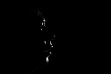 Close-up Of Silhouette Man Against Black Background