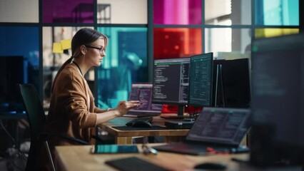Poster - Young Caucasian Woman Programming On Desktop Computer With Two Monitors Setup in Spacious Office. Female Software Developer Creating SaaS Platform For Businesses in Innovative Start-up Company.
