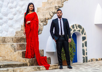 A young Indian couple shooting their pre wedding at a heritage fort in Delhi India. Romantic couple having shoot Delhi. Best young couple India. Pre wedding Indian couple in Delhi in India.