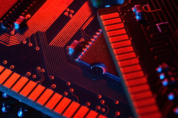 Computer cpu processor chip on circuit board ,motherboard background. Close-up. With red-blue lighting