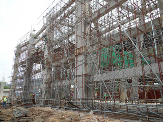 Wall Mural - JOHOR, MALAYSIA -APRIL 13, 2016: Scaffolding used as the temporary structure to support platform, form work and structure at the construction site. Also used it as a walking platform for workers. 
