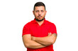 © Asier - Young caucasian man isolated frowning face in displeasure, keeps arms folded.