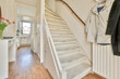 © ADDICTIVE STOCK - White stairs near kitchen at home