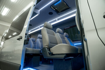 comfortable passenger bus interior with upholstered seats
