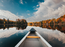 Front Of Canoe On A Calm Lake On A Sunny Autumn Day.