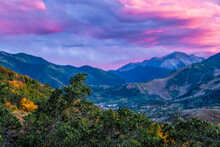 Pink Purple Sunset In Woody Creek In Aspen, Colorado With Rocky Mountains Of Buttermilk Ski Slope Mountain In Autumn And Oak Trees Foliage