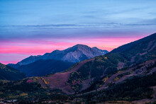 Pink Purple Sunset In Aspen, Colorado With Rocky Mountains Of Buttermilk Ski Slope Mountain In Autumn Fall With Pastel Color Twilight Sunset Or Dusk