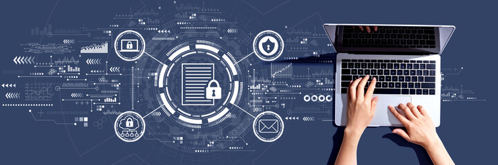 Data protection concept with person using a laptop computer