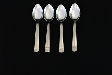 Spoons isolated on black background