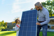 © Halfpoint - Father with his little daughter near their house with solar panels. Alternative energy, saving resources and sustainable lifestyle concept.