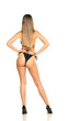 © vladimirfloyd - Pretty young woman posing in black swimsuit on white background. Back, rear view.