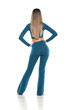 © vladimirfloyd - young modern barefeet woman in blue pants and blouse posing on white studio background. rear, back view