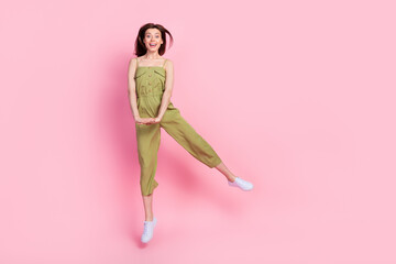 Sticker - Full length photo of satisfied pretty lady dressed khaki outfit dance rejoice shopping sale empty space isolated on pink color background