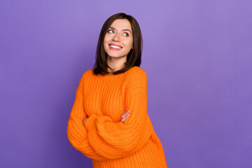 Sticker - Portrait of positive pretty girl crossed hands toothy smile look empty space isolated on purple color background